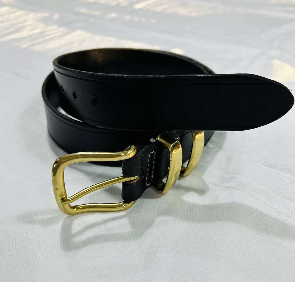 Black leather belt with gold buckle, 38 inch